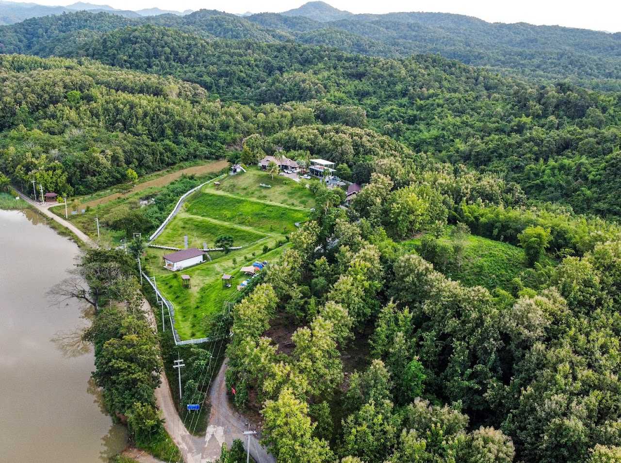 The Best Feng Shui House For Sale, surrounded by reservoir and mountains.